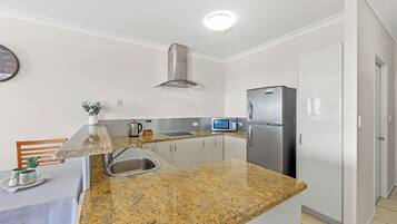 Standard Apartment, 1 Bedroom, Non Smoking, Kitchen (Ocean Studio Apartment) | Private kitchen | Full-sized fridge, microwave, stovetop, dishwasher