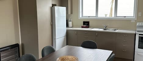 Cottage, 3 Bedrooms | Private kitchen | Fridge, microwave, highchair