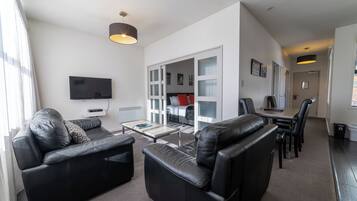 Premier One-Bedroom Apartment | Living area | 40-inch LCD TV with satellite channels, TV
