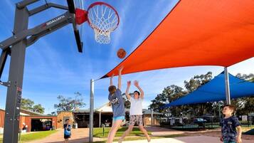 Enjoy a game of basketball under the shade of our outdoor court.