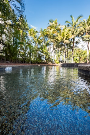 Outdoor pool, a heated pool, free pool cabanas