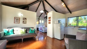Bungalow | Living area | 32-inch TV with digital channels, DVD player, toys - Aroa Kainga Bungalows (Rarotonga)