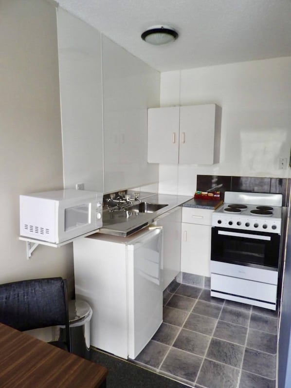 Family Suite, 1 Bedroom | Private kitchen | Fridge, microwave, coffee/tea maker