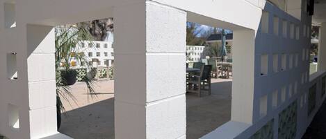 A white, geometric structure with a patterned base, possibly a part of a building or a decorative element.