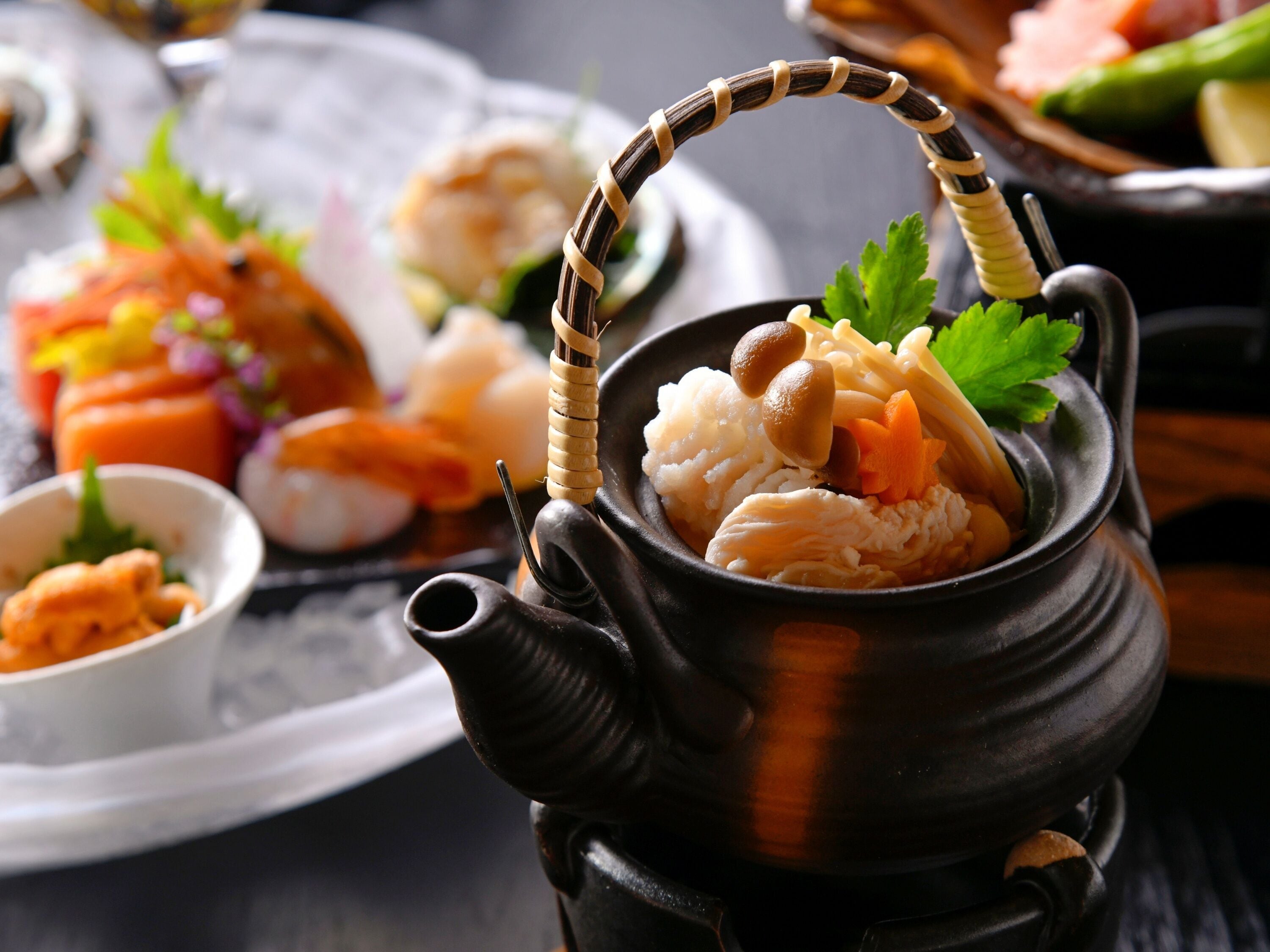 A traditional Japanese tea set with a teapot and cups.
