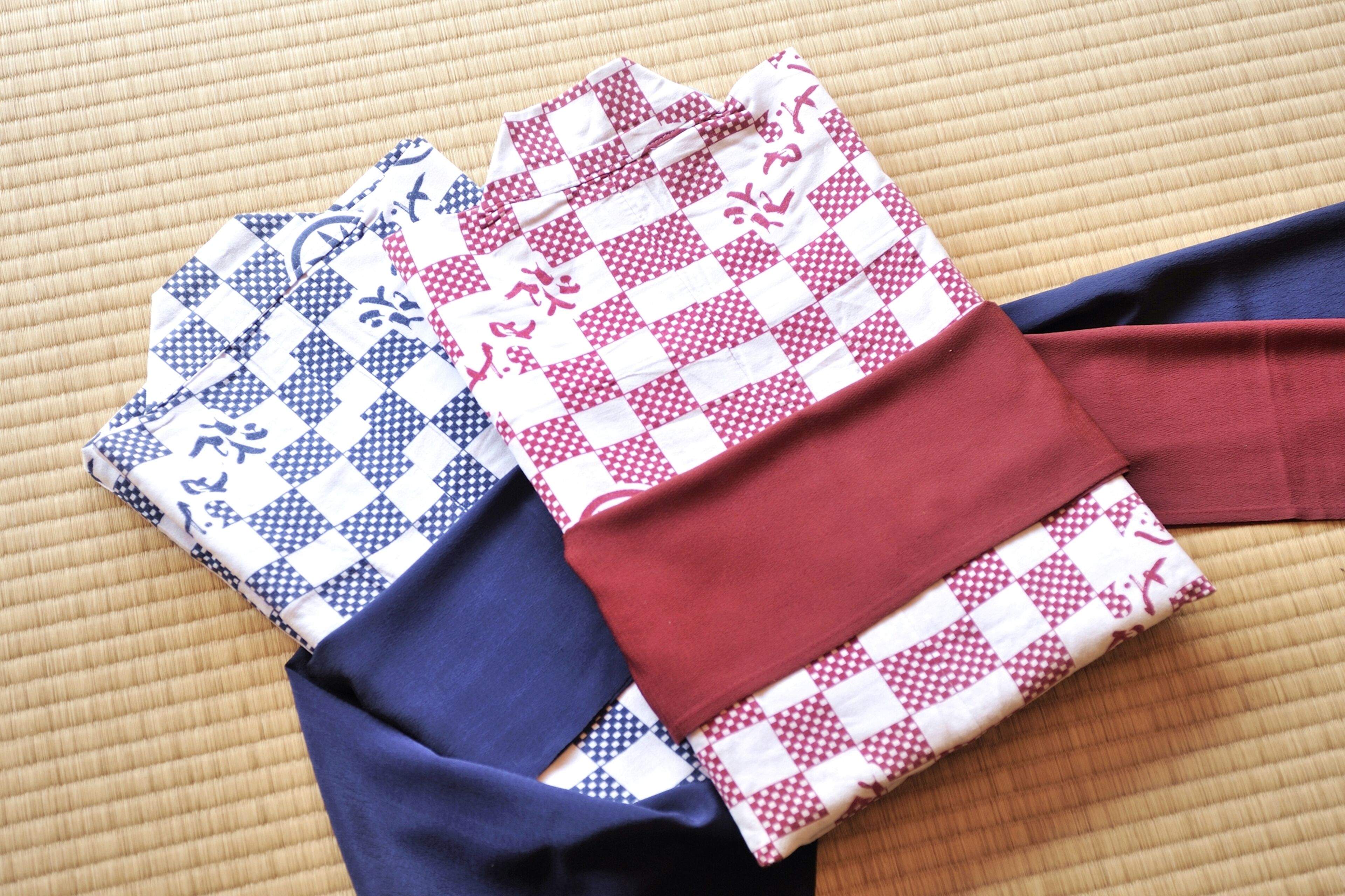 A patterned fabric laid out on a textured surface.