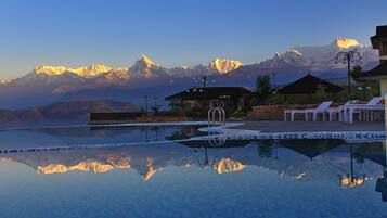 Outdoor pool, open 8:00 AM to 7:00 PM, pool loungers