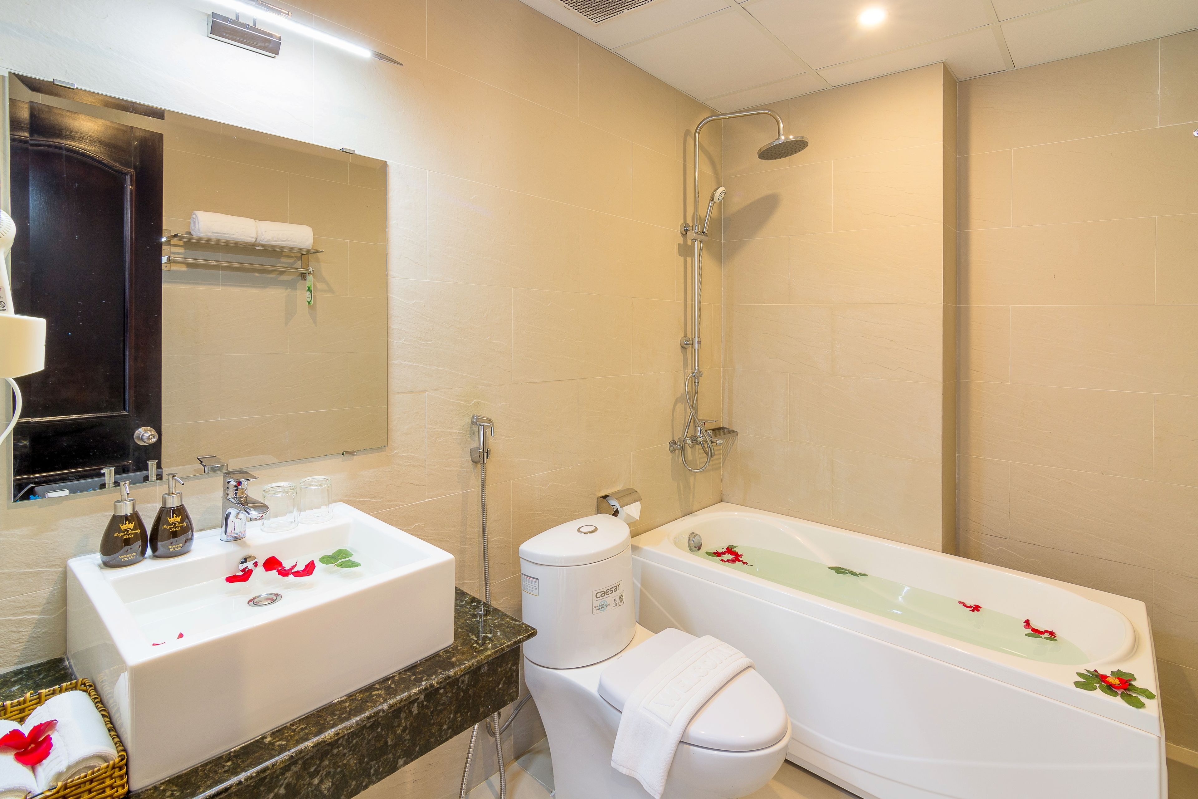 designer toiletries, hair dryer, bathrobes, slippers