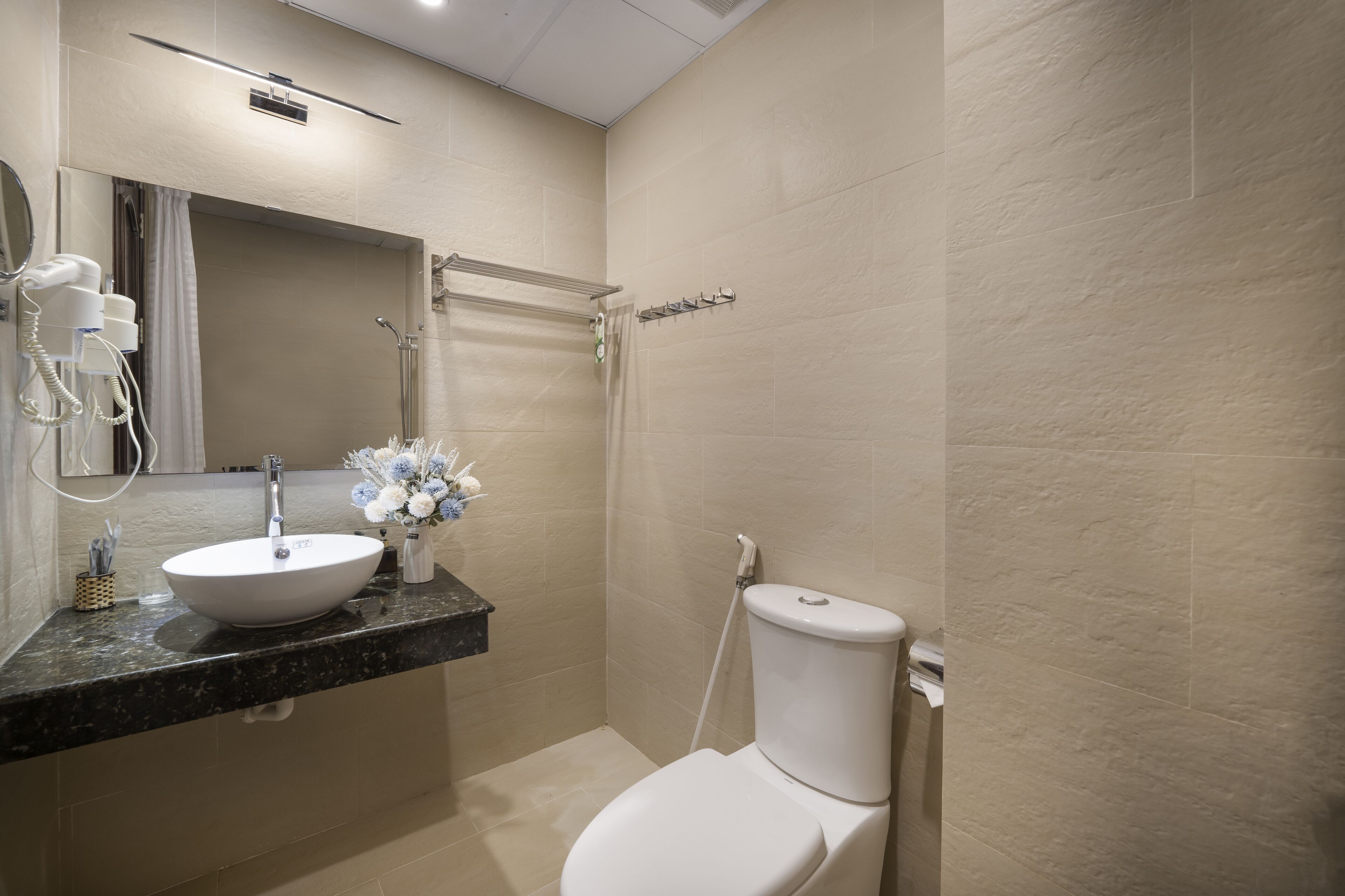 designer toiletries, hair dryer, bathrobes, slippers