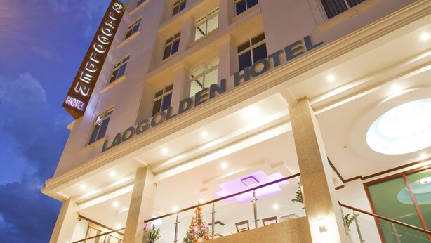 A multi-story hotel with a prominent entrance, large windows, and a well-lit facade. - Lao Golden Hotel (Vientiane)
