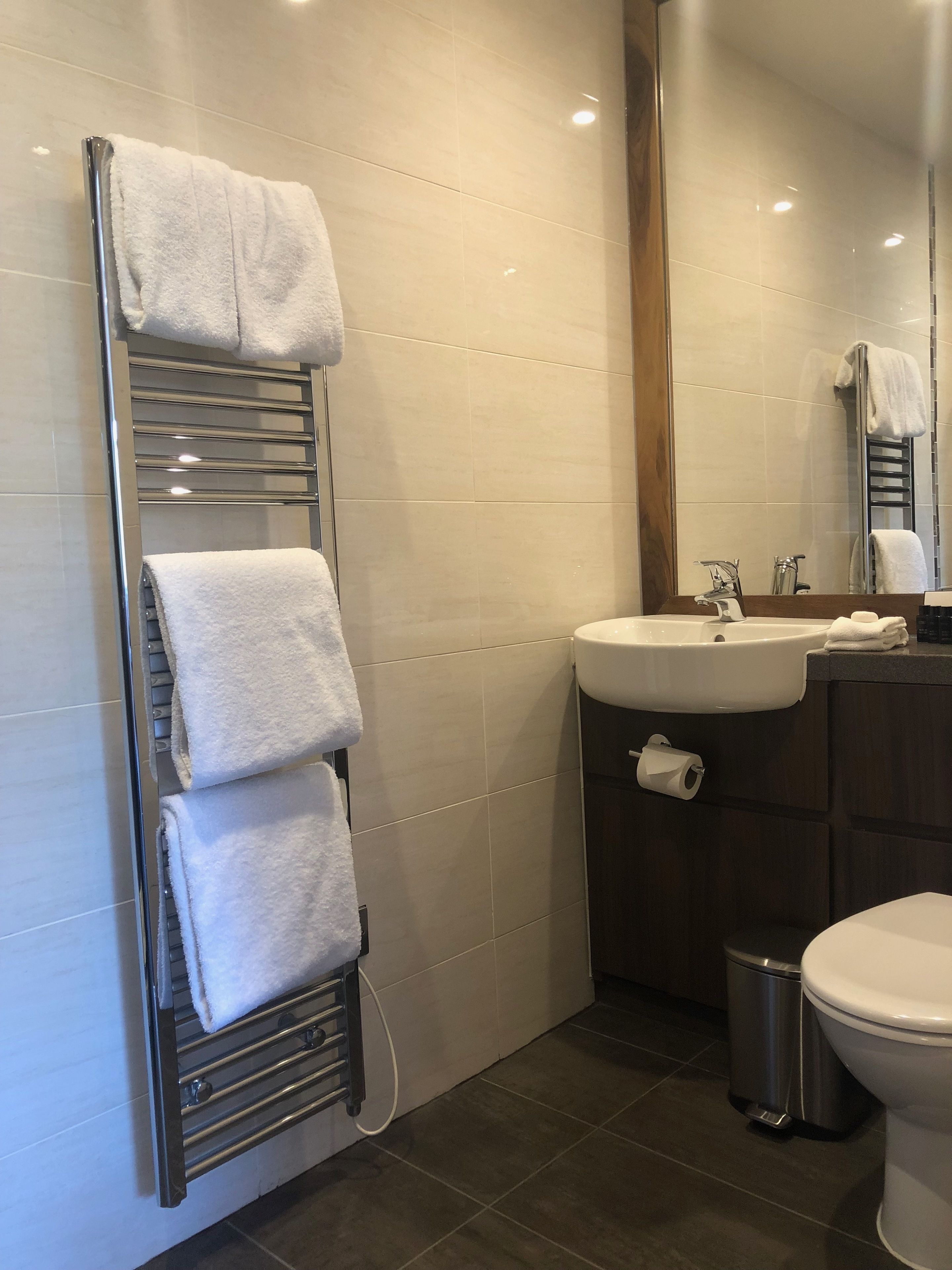 shower, designer toiletries, hair dryer, towels