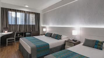 Standard Triple Room | Minibar, in-room safe, individually decorated, individually furnished