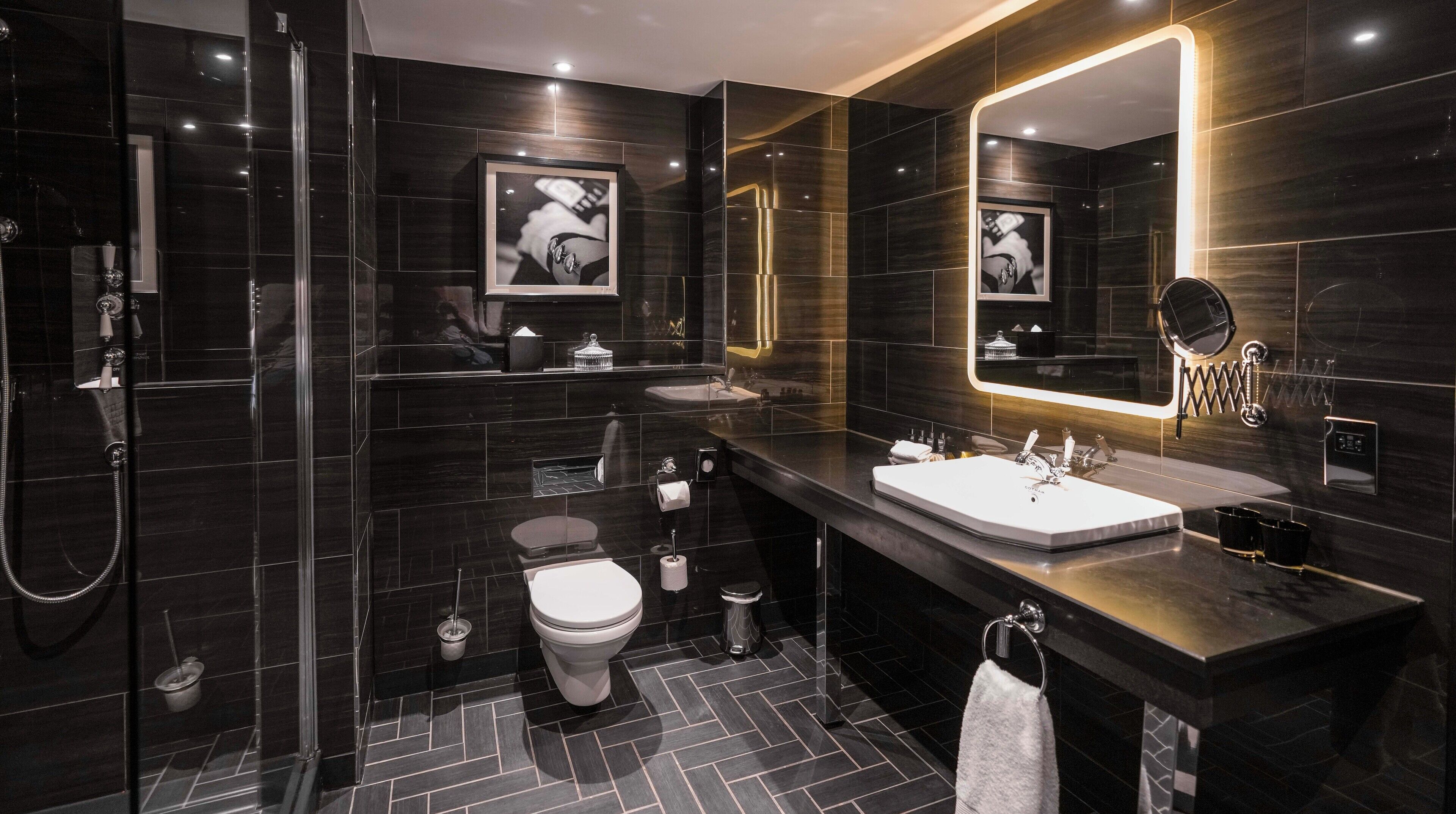 inner sanctum suite | bathroom | shower, rainfall showerhead, designer toiletries, hair dryer
