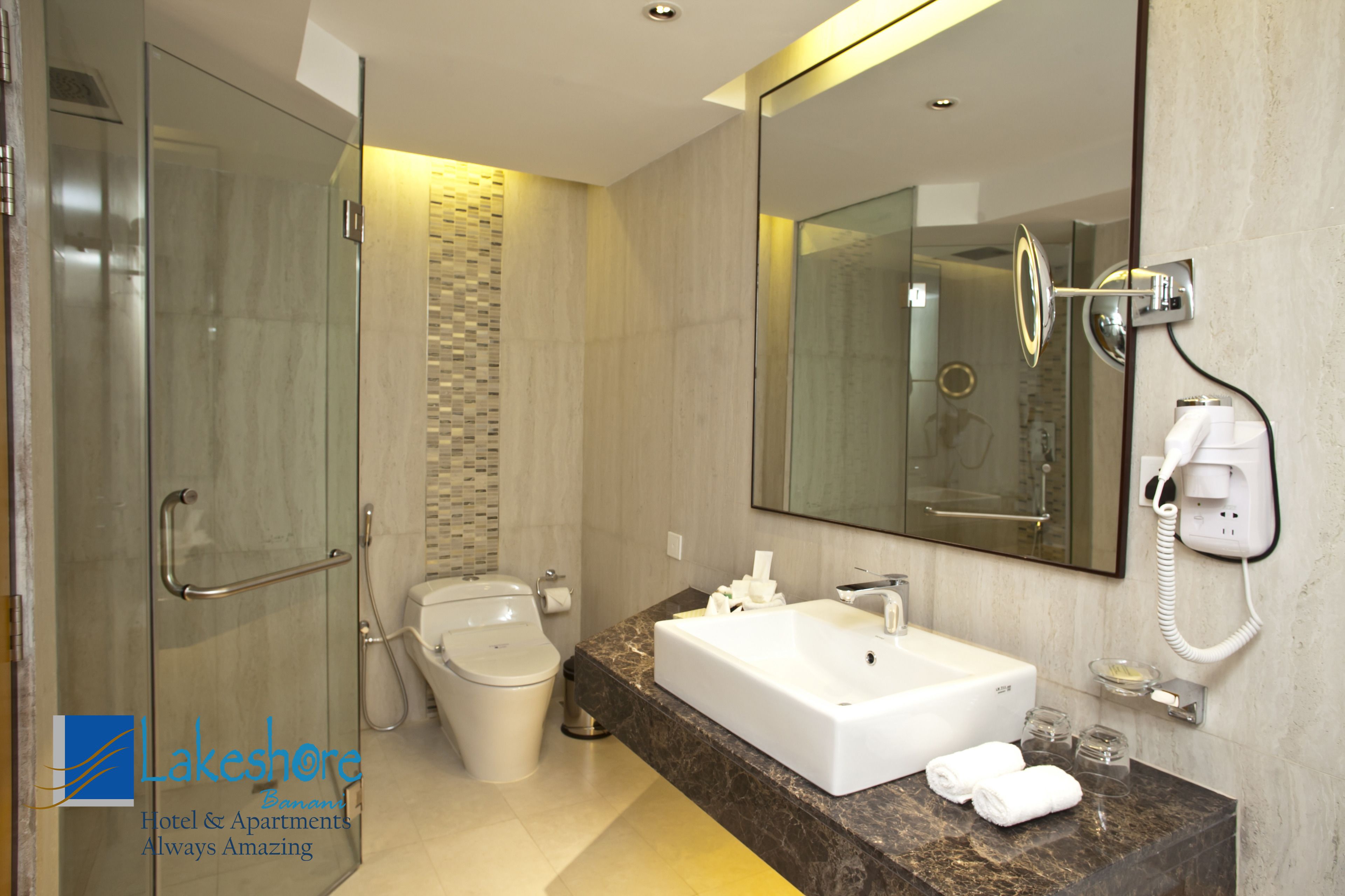 business suite | bathroom | separate bathtub and shower, free toiletries, hair dryer, slippers