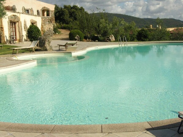 Seasonal outdoor pool, pool umbrellas, pool loungers