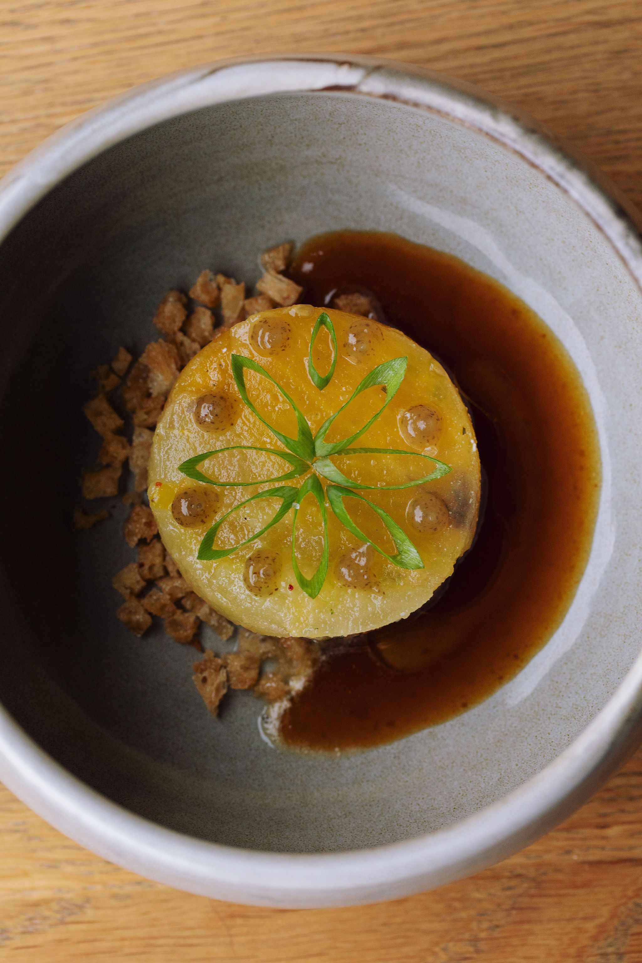 A bowl of food with a decorative garnish.