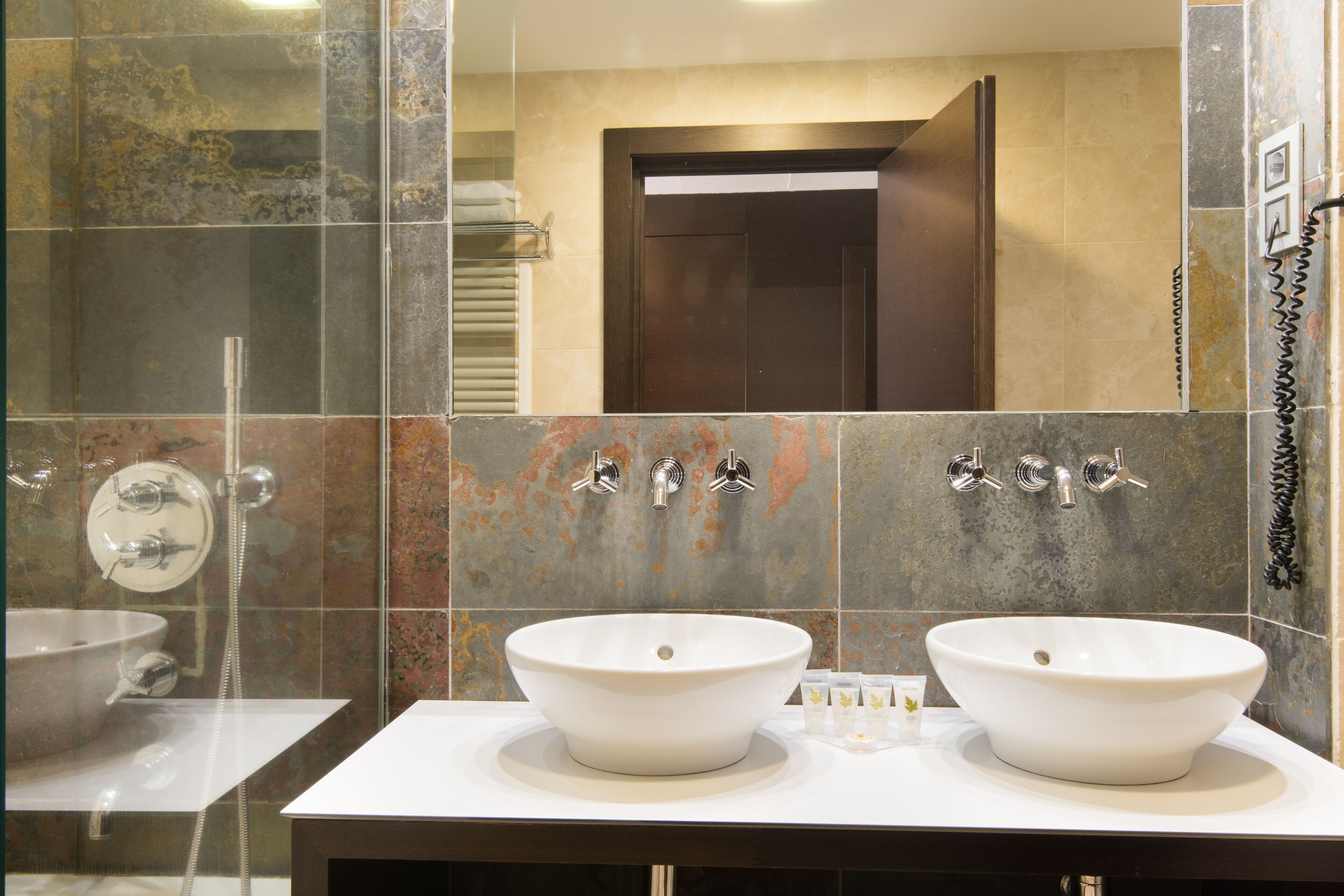 deep-soaking bathtub, rainfall showerhead, free toiletries, hair dryer