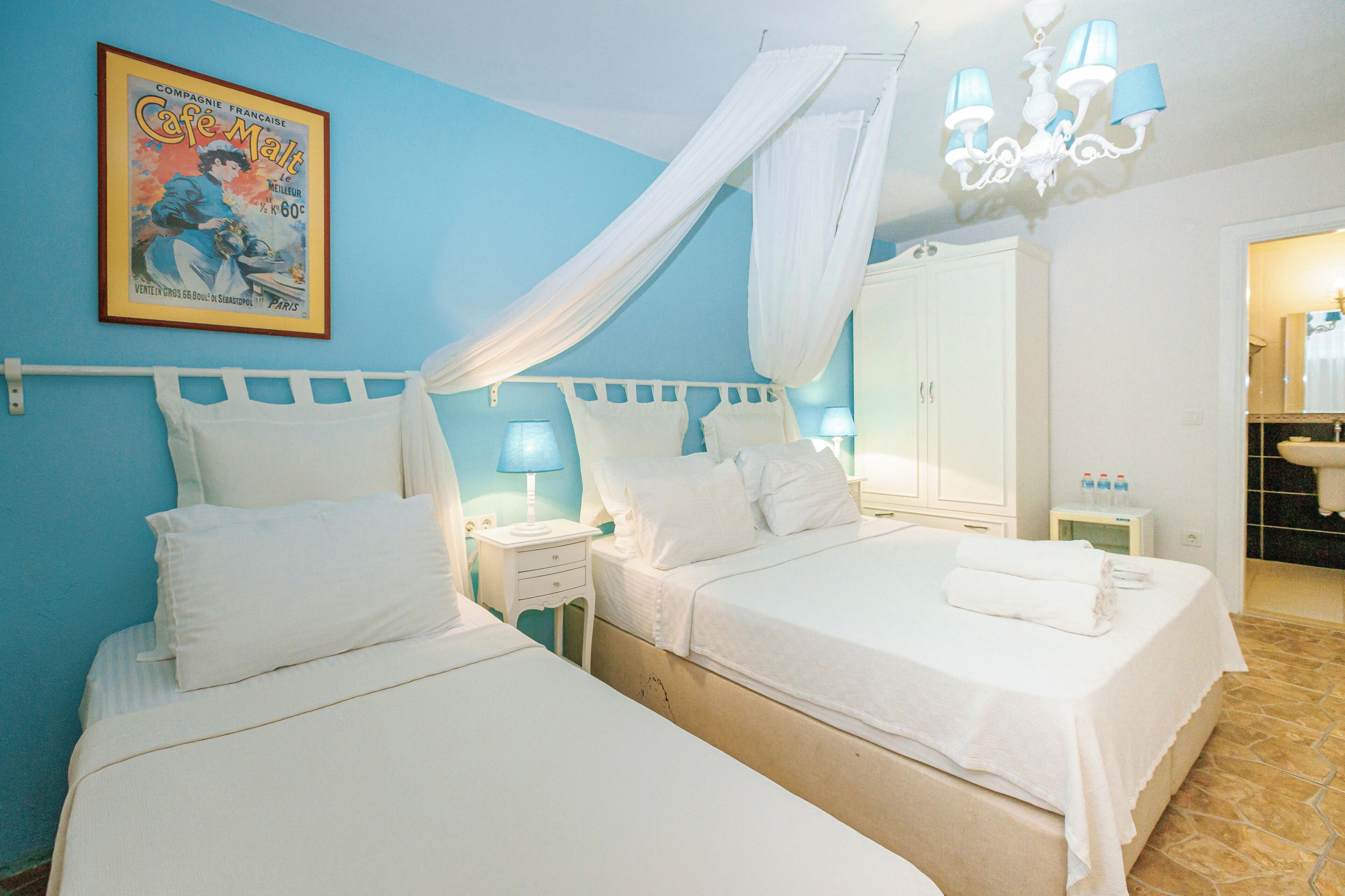 Economy Triple Room (Half Basement) | Minibar, in-room safe, soundproofing, iron/ironing board (on request)