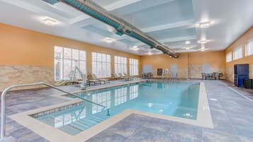 Indoor pool, open 9:00 AM to 9:00 PM, pool loungers
