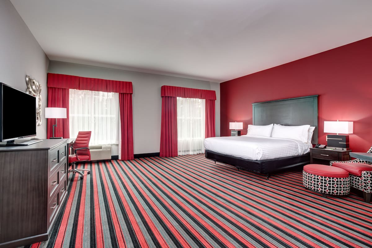 Hypo-allergenic bedding, desk, laptop workspace, blackout drapes