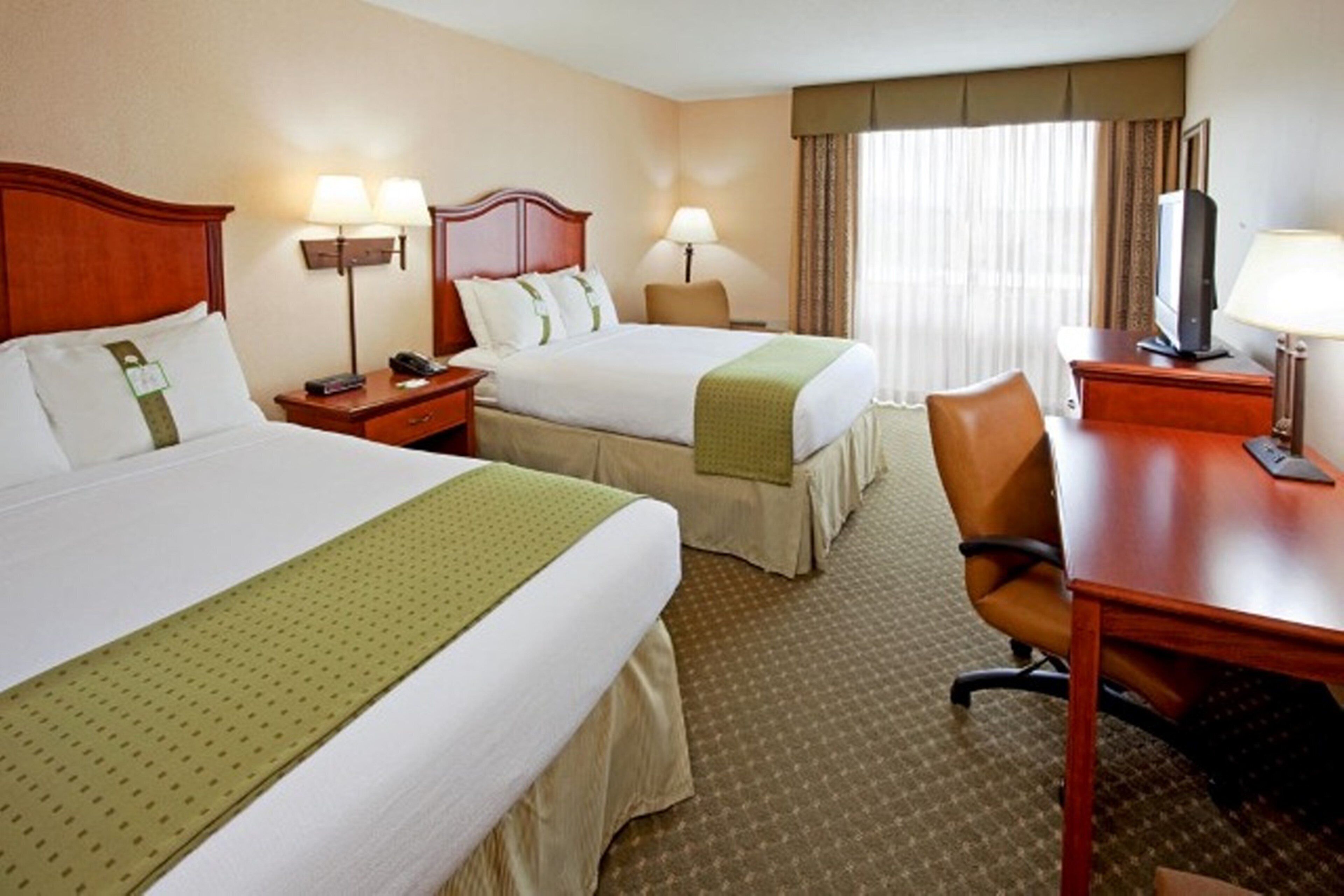 Hypo-allergenic bedding, desk, laptop workspace, blackout curtains