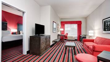 Hypo-allergenic bedding, desk, laptop workspace, blackout drapes