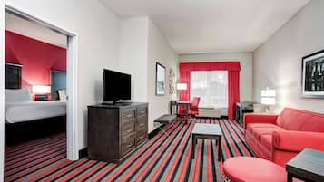 Hypo-allergenic bedding, desk, laptop workspace, blackout drapes