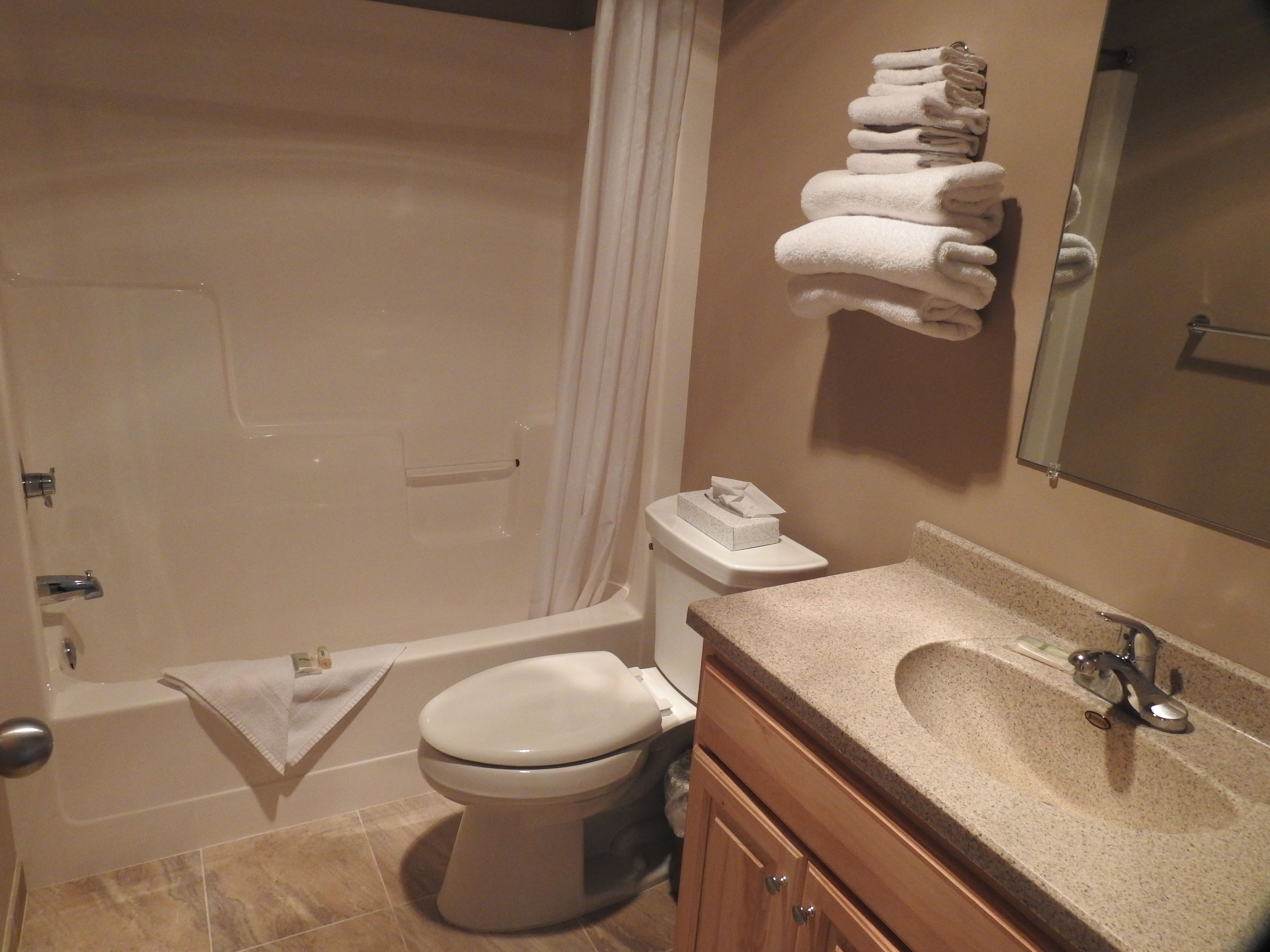 room, lake view | bathroom | hair dryer, towels, soap, shampoo