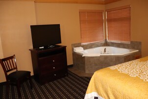 Whirlpool Suite Room | Individually decorated, individually furnished, desk, iron/ironing board