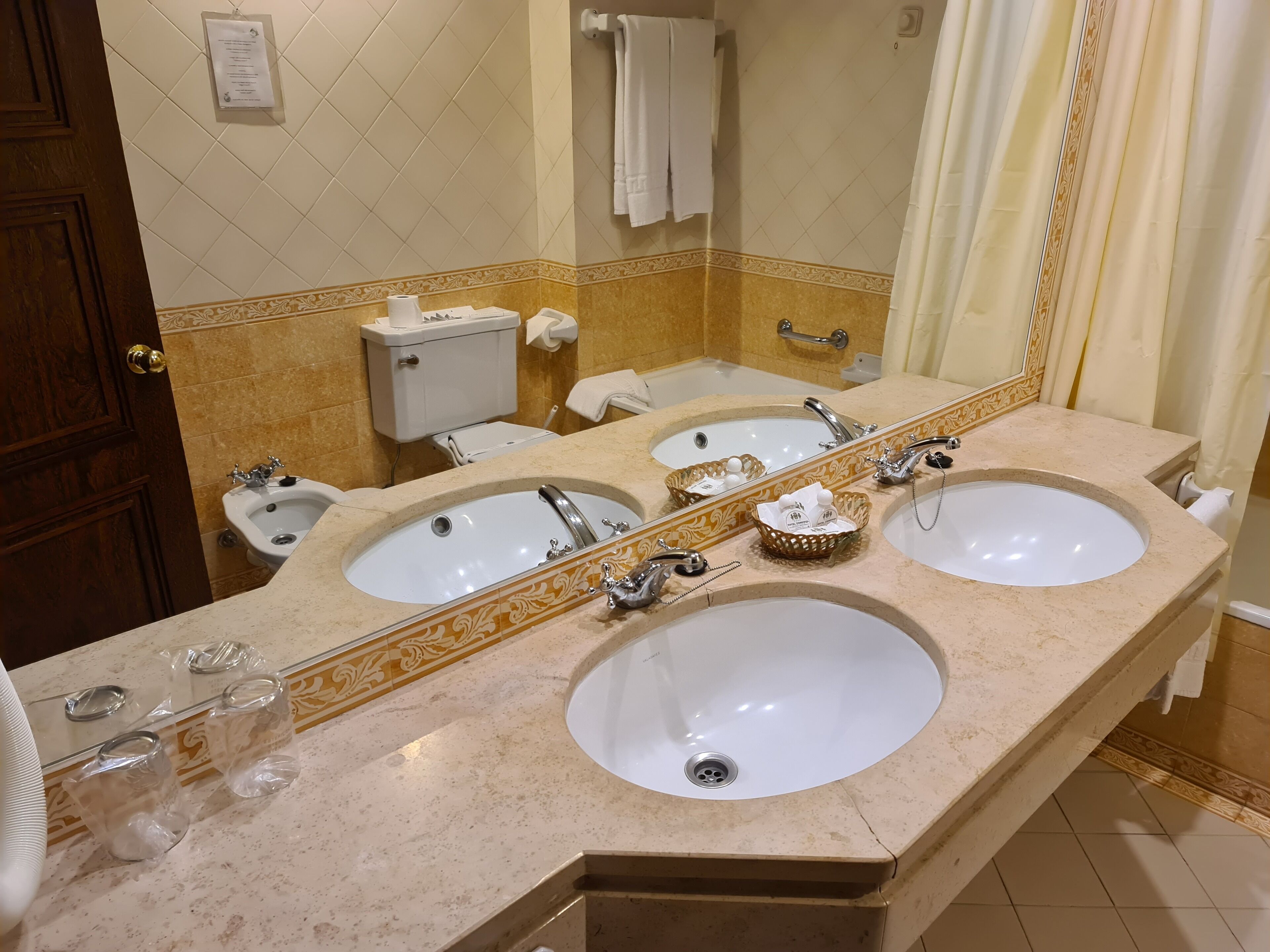 bathtub, hair dryer, towels