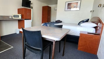 Desk, laptop workspace, iron/ironing board, cots/infant beds