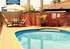 Outdoor pool, open 7:00 AM to 9:00 PM, pool umbrellas, sun loungers