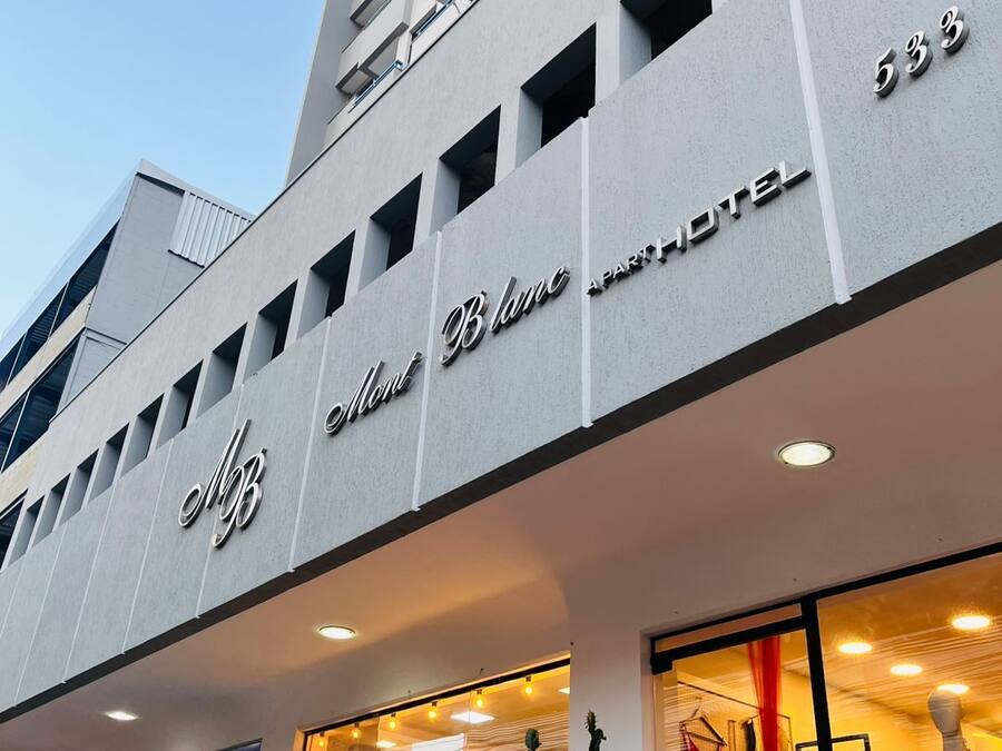 A building with a sign for 'Blanc Boutique Hotel'.