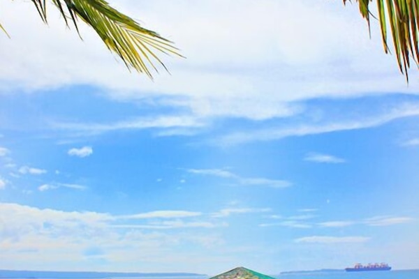 On the beach, sun loungers, beach towels, scuba diving