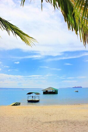 On the beach, sun-loungers, beach towels, scuba diving