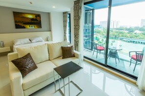 Superior Studio with pool view | Living area | 45-inch flat-screen TV with cable channels, TV