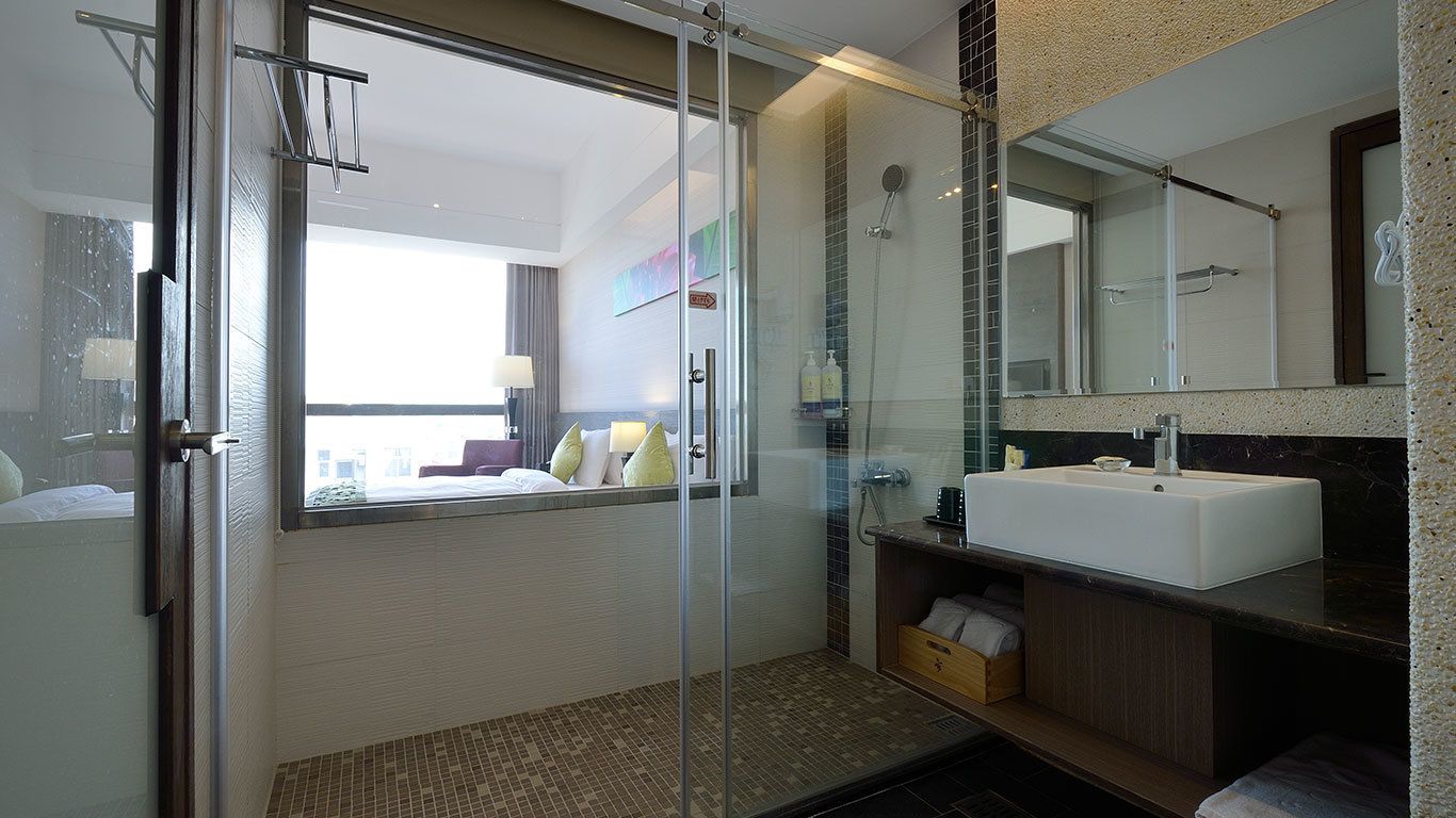 shower, hair dryer, slippers, towels