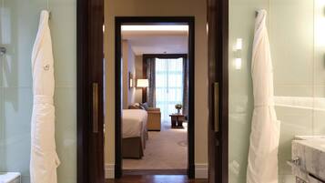 Deluxe Junior Suite | Bathroom | Rainfall showerhead, designer toiletries, hair dryer, bathrobes