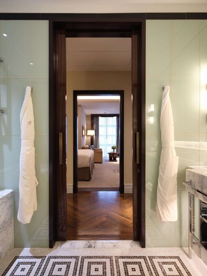 Deluxe Junior Suite | Bathroom | Rainfall showerhead, designer toiletries, hair dryer, bathrobes