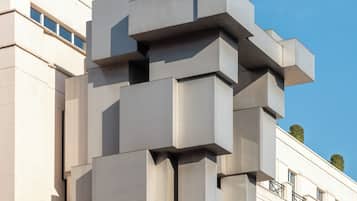A modern building with a unique geometric facade, labeled "The Beaumont Hotel."