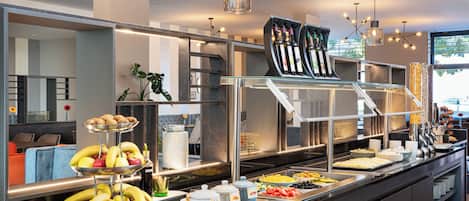 A buffet setup with various food items and a wine selection.