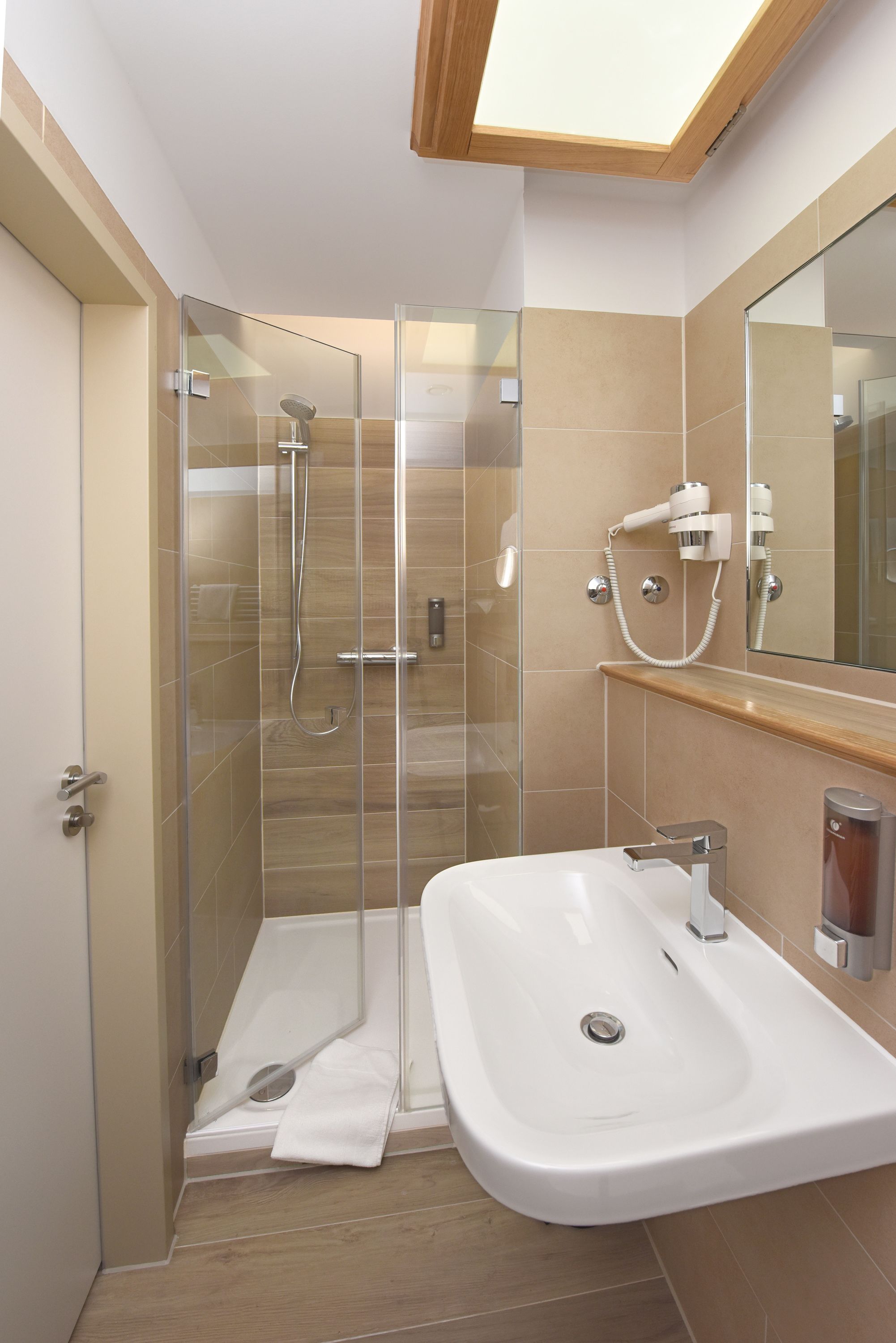 shower, hair dryer, slippers, towels