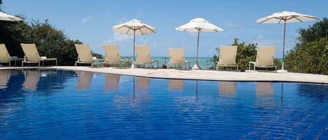 Outdoor pool, pool umbrellas, sun loungers