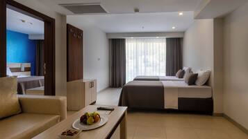 JUNIOR SUIT LAND VIEW | Minibar, in-room safe, desk, laptop workspace