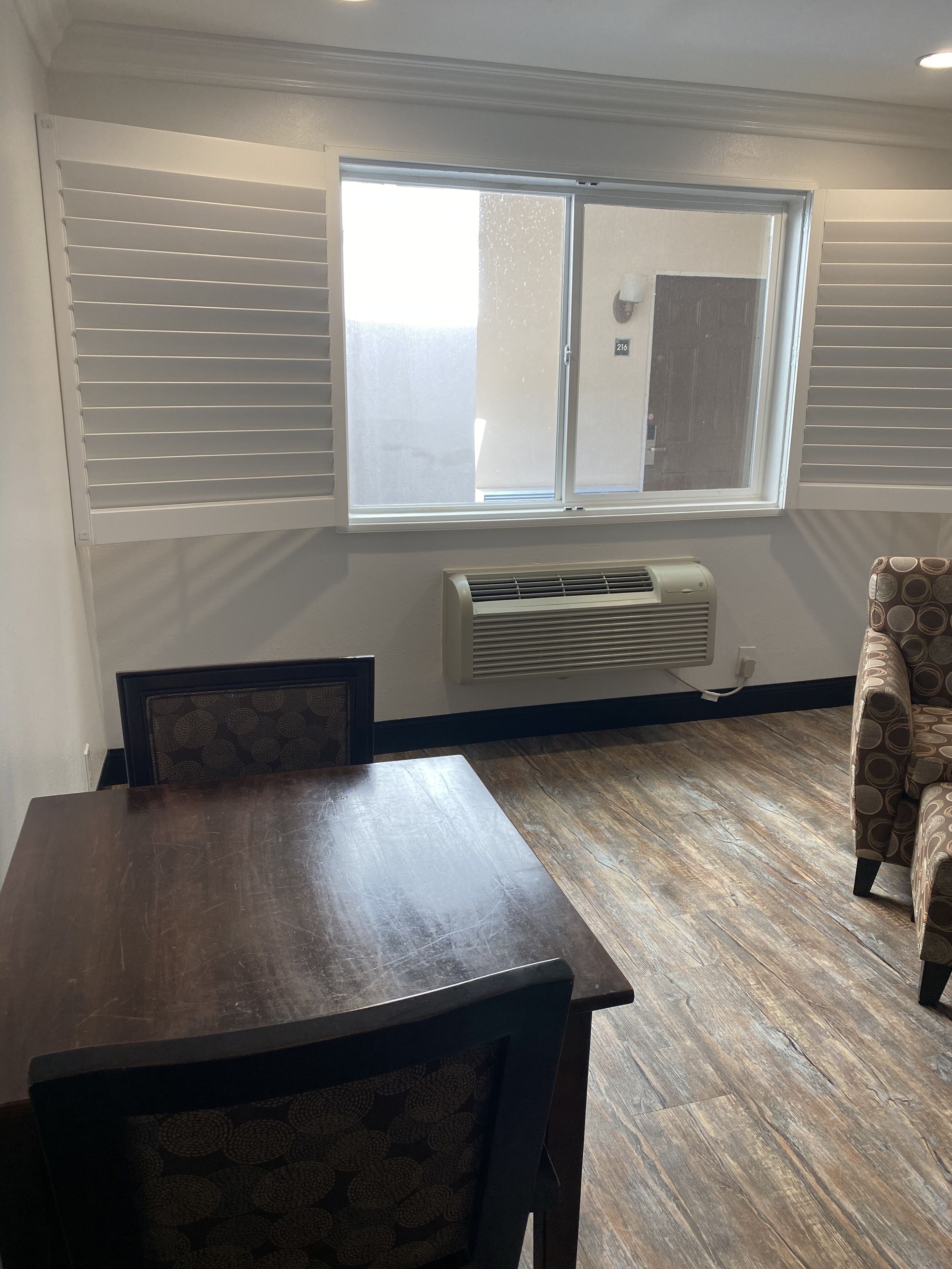 economy room, 1 king bed, refrigerator & microwave | 1 bedroom, desk, blackout curtains, iron/ironing board