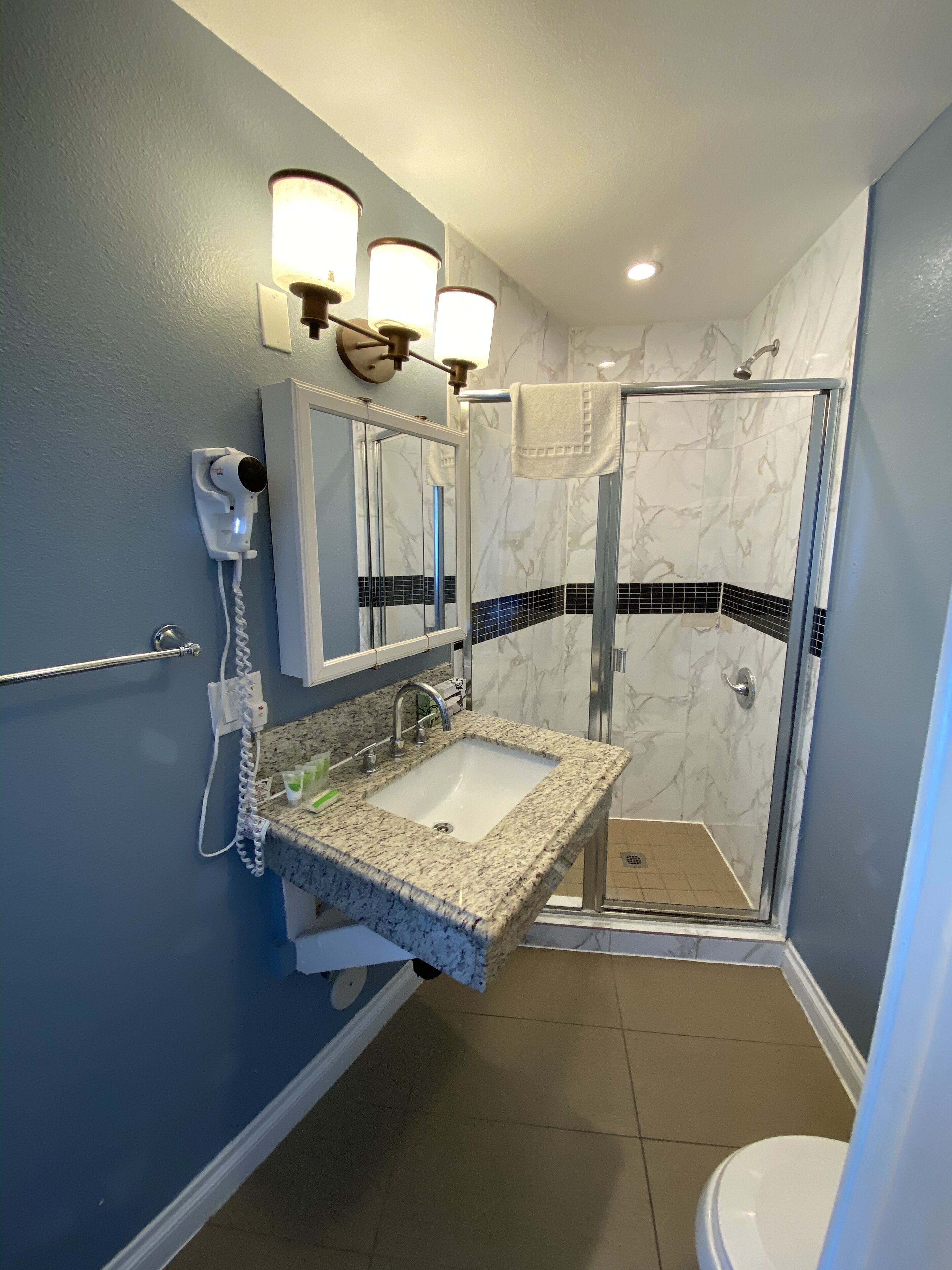 free toiletries, hair dryer, towels, shampoo