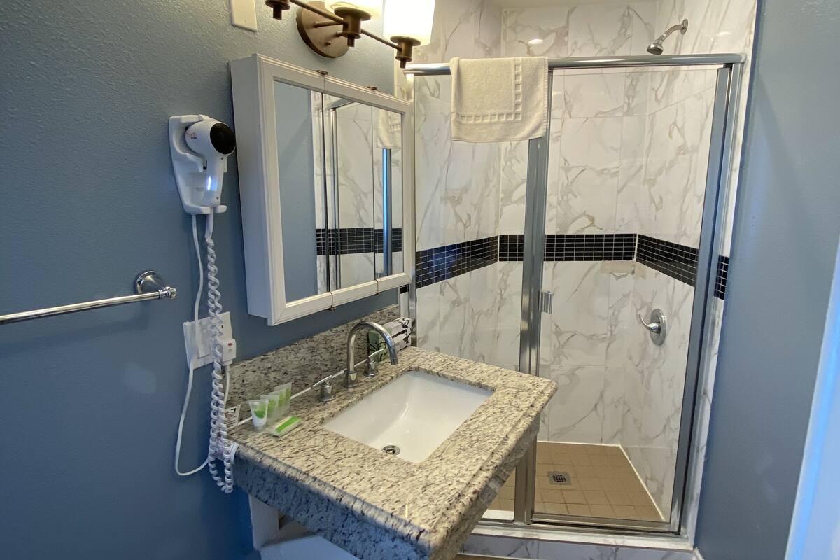 free toiletries, hair dryer, towels, shampoo