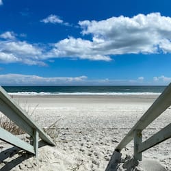 On the beach, white sand, beach towels