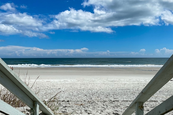 On the beach, white sand, beach towels
