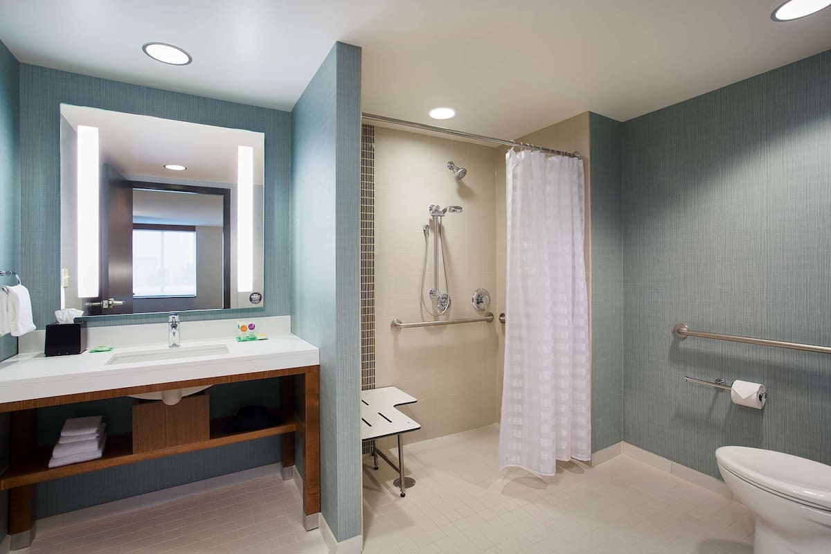 room, 1 king bed, accessible (shower) | bathroom | designer toiletries, hair dryer, towels
